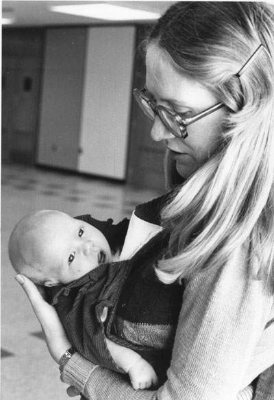 A woman and her baby at the Women Aware Conference