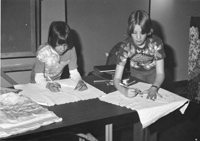 Two young kids at the Women Aware Conference