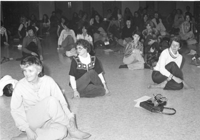 Women practice yoga at the Women Aware Conference
