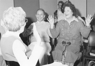 Women doing a fun exercise at the Women Aware Conference