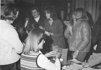 Women signing up for classes at the Women Aware Conference