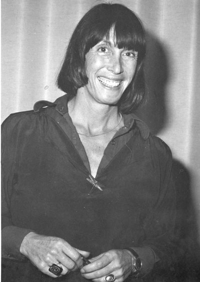 A woman poses for a photo at the Women Aware Conference