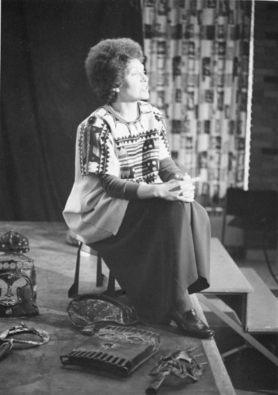 A woman presenting of masks she has welded at the Women Aware Conference