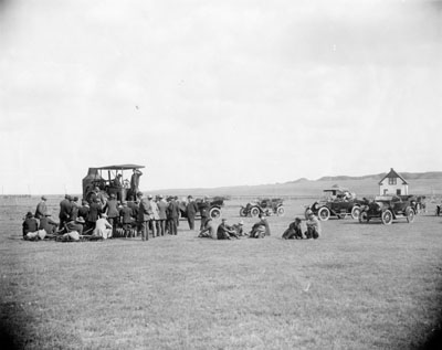 People gathered around for lectures and demonstrations near Glendive, MT, part of the M.L. Wilson flax series, 1912