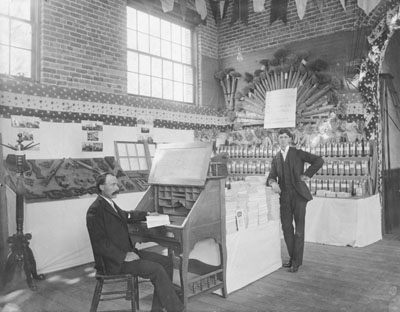 Two men standing at an exhibit at the Montana State Fair