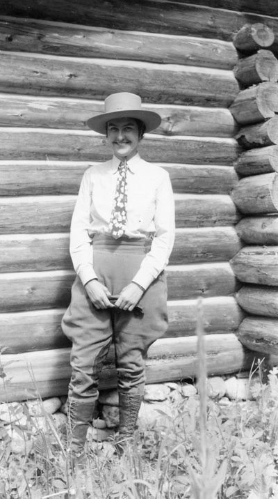 Harriette Cushman standing with a hat