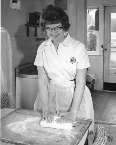 Patty Crow from Roberts, MT works on kneading dough for 4-H bread demonstrations.