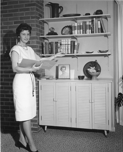 Barbara Barney shows some activates from her home improvement record book for 4-H.