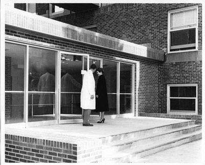 Dr. Richard McBee at the entrance to Cooley Laboratory, 1959