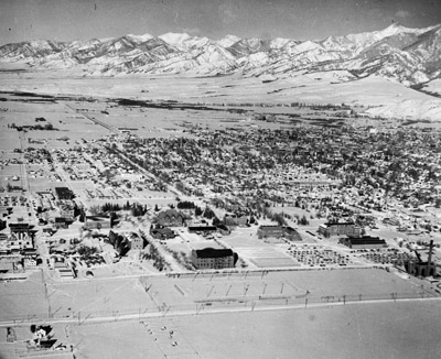 Aerial view of campus, the city of Bozeman and the Bridgers in the background taken in the winter, 1947