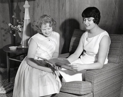 Carolyn Wells and Julie Coombs of Billings, Montana Read a Recent Issue of the National 4-H News