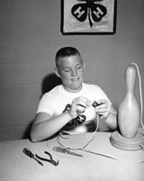 Andy Pickens, from Huntley, Montana Finishes up a Lamp he has Built