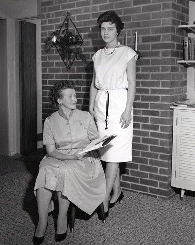 Barbra Barney and Mrs. Charles Barney Look Over the 4-H Awards Handbook