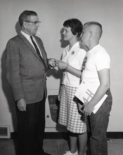 Max Matthews Presents County Medal Awards to Vicki Seidel and Andy Pickens, from Huntely, Montana