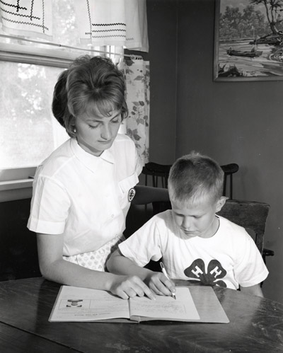 Marilyn Creek Gives her Brother, Kermit Creek help with his Homework, Billings, Montana