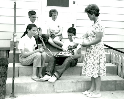 Ronald Hasse, Diana Malkuch, Betty Lou Brown and Gary Haase go over their Entomology Projects with their Leader, Mrs. Fred Haase.