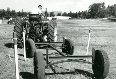 A 4-H Member Performing in a Tractor Driving Contest.
