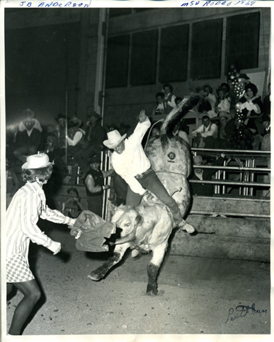 J. B. Anderson riding a bull
