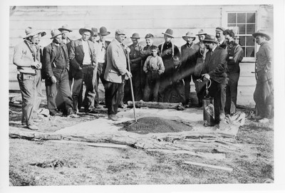 M.L. Wilson demonstrating flax seed treatment