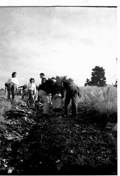 Hauling a milk can of whitewash on "M" Day
