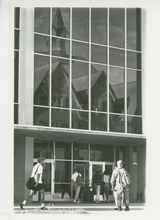 Reflection of Montana Hall in Renne Library windows