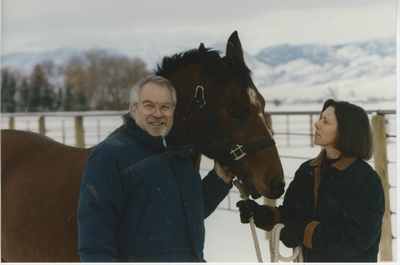 Geoff and Patricia Gamble outdoors with horse