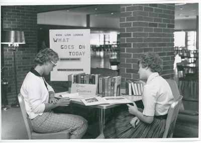 Two women reading books, 1961