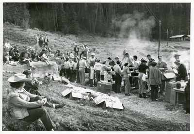 Men, women, and children attending a summer school picnic