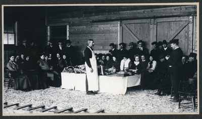 George Foerschler demonstrating meat cutting, 1905