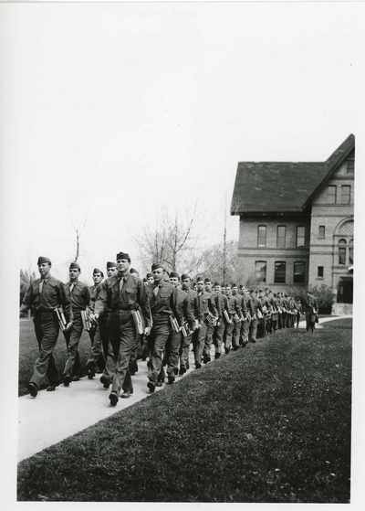 ROTC members marching in front of Montana Hall