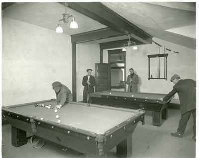 Students playing pool in YMCA recreation room
