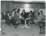 Group of foreign students around table, 1952