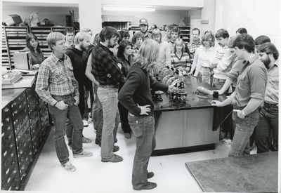 Students standing in a geology laboratory, 1985