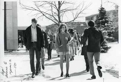 Students walking on campus, 1975