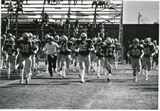 Football team running onto the field