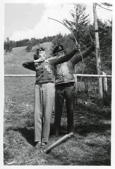 Man and woman practicing archery