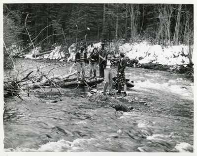 Students standing in a river, 1940