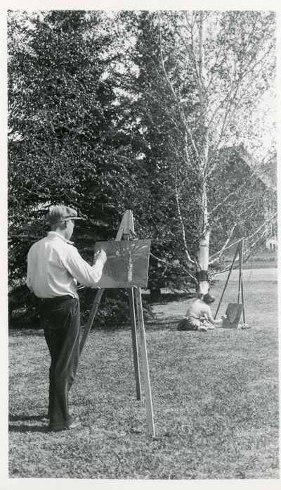 Man standing with easel, June 1930