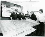 Student reviewing drawings with teacher, 1980