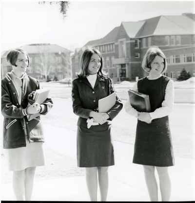 Three female students in front of the Strand Union Building
