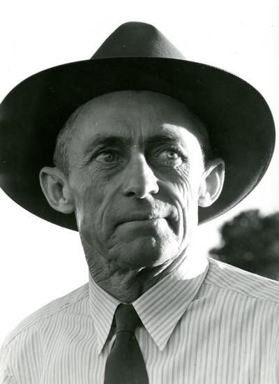 Portrait of Jack Arnold, Part Owner of Quarter Circle U Ranch, Montana standing.