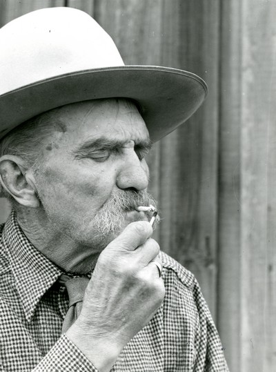 Frank Latta Lighting a Hand Rolled Cigarette