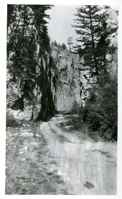 Natural Bridge, Mission Canyon, Little Rockies - Road Scene
