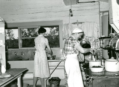 Cook and Hired Girl in Kitchen of Quarter Circle U Ranch, Montana