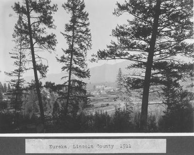 View Between Evergreens of Eureka, Lincoln County, 1911