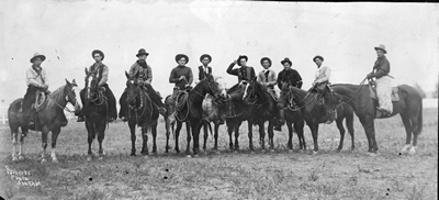 Group photograph of cowboys from a roundup
