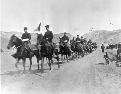President Roosevelt (lead by a dog) walking past cavalry in Gardiner