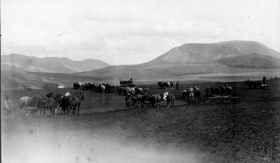 Farmers preparing field for planting in Montana