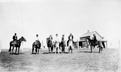 Ranchers on their mounts on the prairie