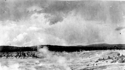Geyser basin with tourists exploring - Yellowstone National Park